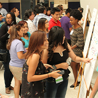 Davidoff Near Northside Community Meeting Community members review details of the new community plan at an open house. Photo courtesy of Avenue CDC and the University of Houston Community Design Resource Center.